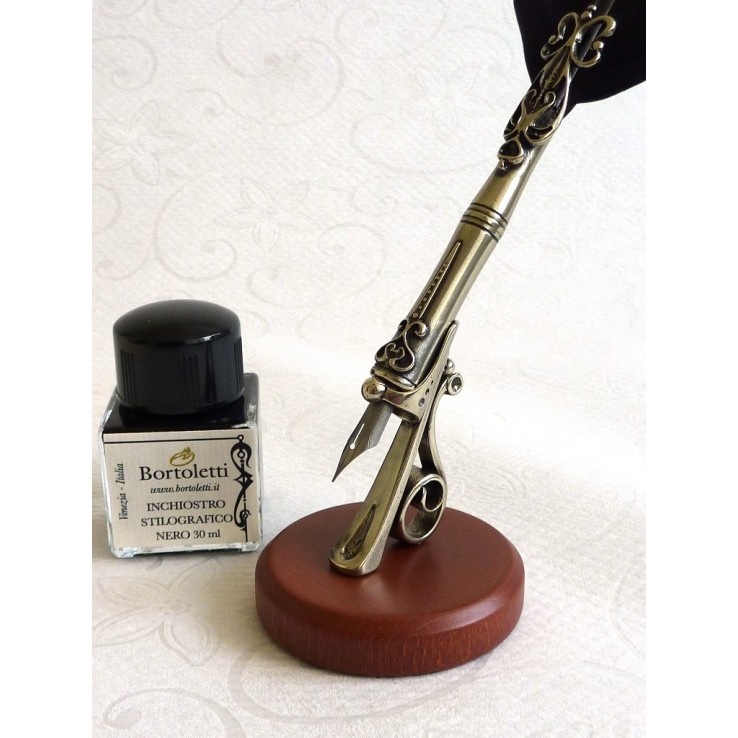 Pluma, cinco puntas y portalápices